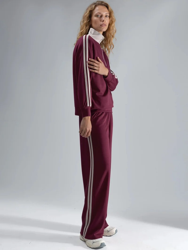 هيكاب طقم نسائي قطعتين مخطط بأرجل واسعة وياقة بسحاب من مجموعة بيرسان